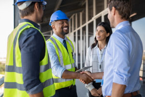 Engineer and businessman handshake at construction site for Environmental Justice